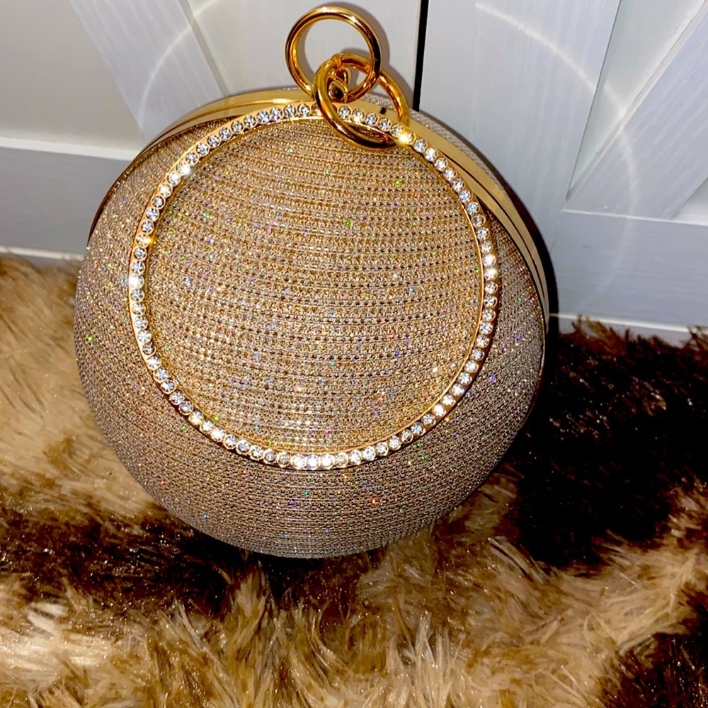 Absolutely stunning gold world globe clutch